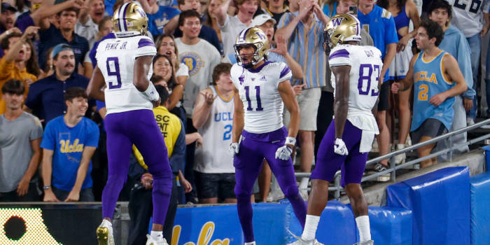 Washington's Jalen McMillan (11) celebrates with teammates after scoring a touchdown against the UCLA during an NCAA college football game Friday, Sept. 30, 2022, in Pasadena, Calif.